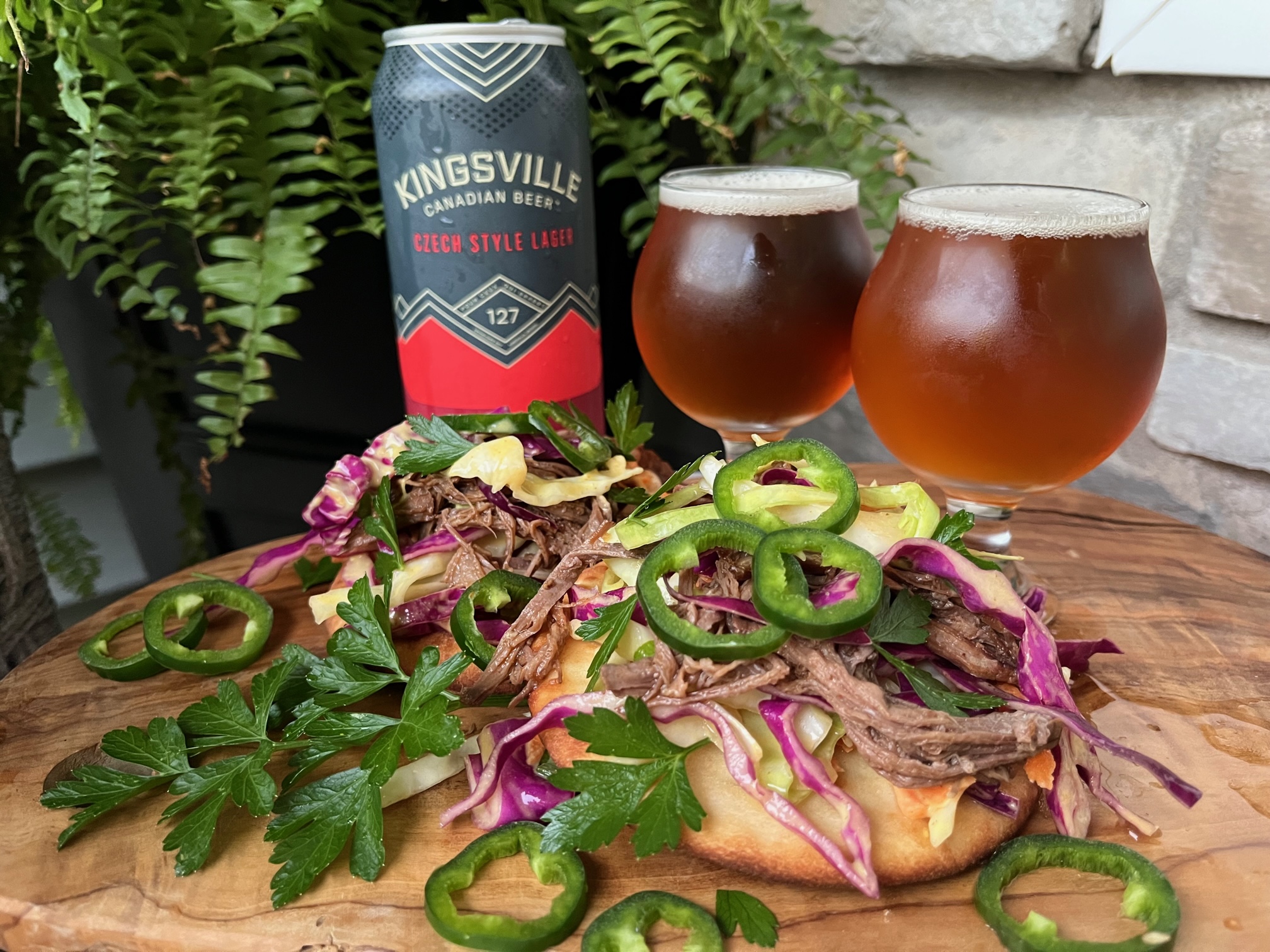 Featured image for “Kingsville Brewin Co. Czech Style Lager with Sweet Jalapeno Coleslaw on Pulled Beef Brisket.”
